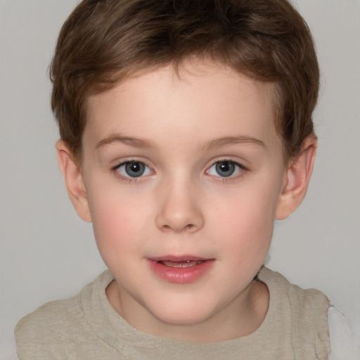 Joyful white child female with short  brown hair and grey eyes