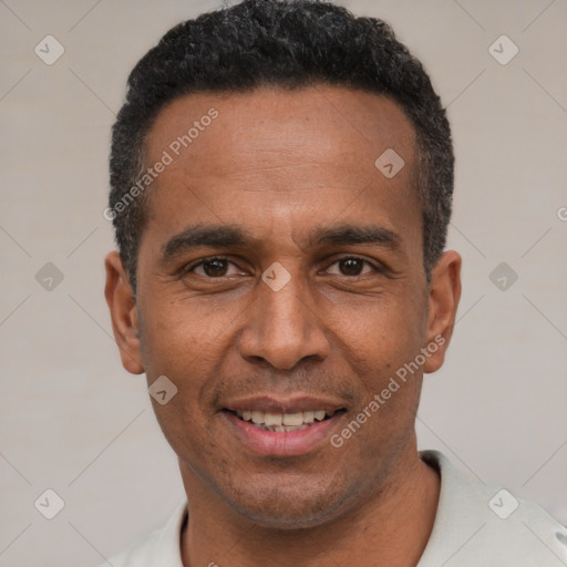 Joyful latino adult male with short  black hair and brown eyes