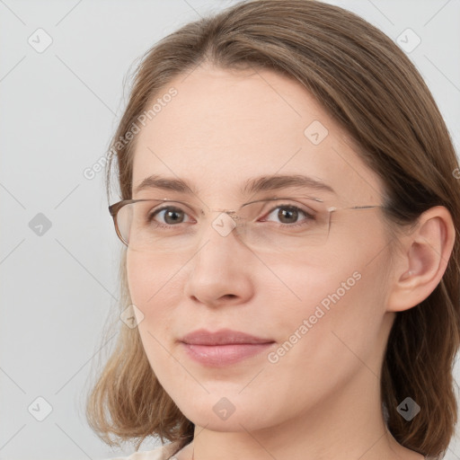 Joyful white young-adult female with long  brown hair and blue eyes