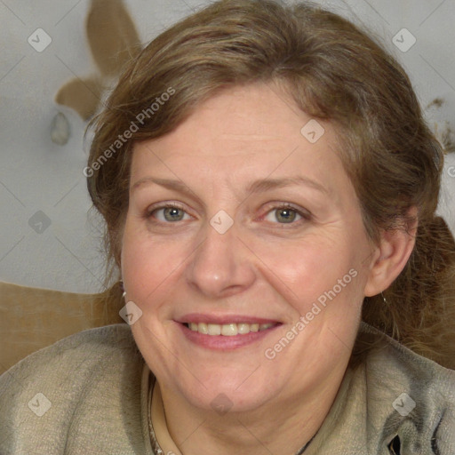 Joyful white adult female with medium  brown hair and grey eyes