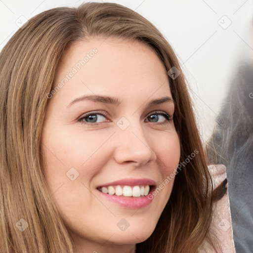 Joyful white young-adult female with long  brown hair and brown eyes