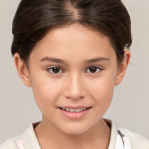 Joyful white child female with short  brown hair and brown eyes