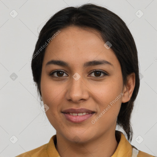 Joyful latino young-adult female with medium  brown hair and brown eyes