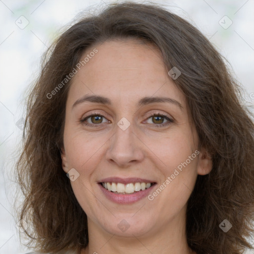 Joyful white adult female with long  brown hair and brown eyes