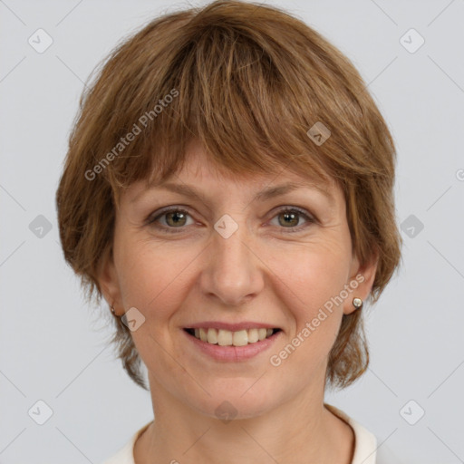 Joyful white adult female with medium  brown hair and grey eyes