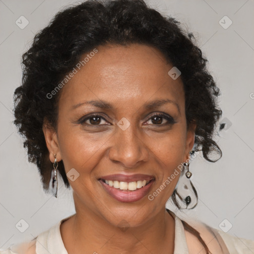 Joyful black adult female with short  brown hair and brown eyes