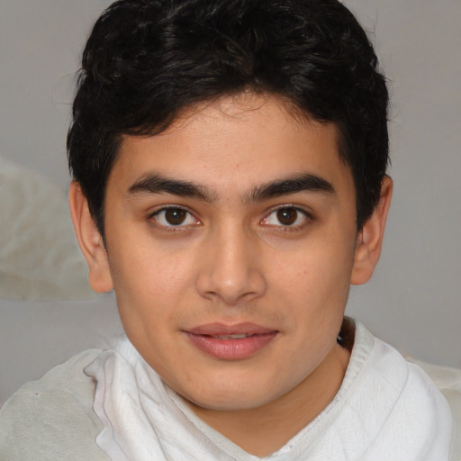 Joyful latino young-adult male with short  brown hair and brown eyes