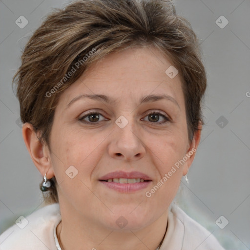 Joyful white adult female with short  brown hair and brown eyes