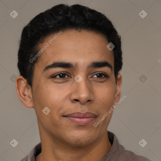 Joyful latino young-adult male with short  brown hair and brown eyes