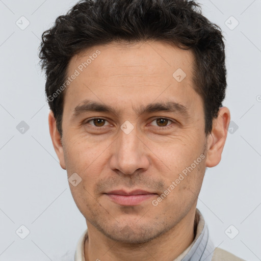 Joyful white adult male with short  brown hair and brown eyes