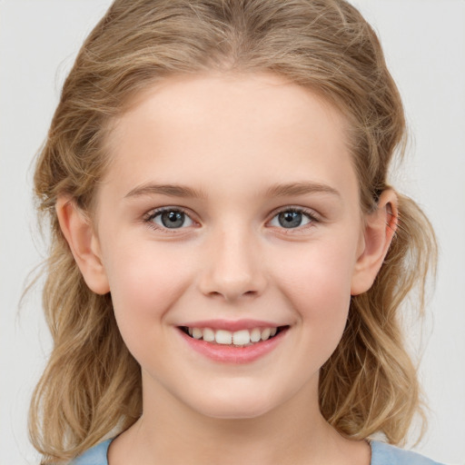 Joyful white child female with medium  brown hair and grey eyes