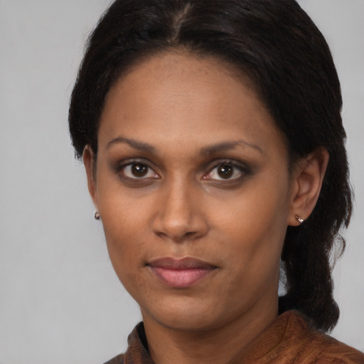 Neutral black adult female with short  brown hair and brown eyes