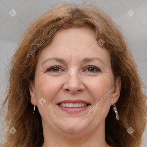 Joyful white adult female with medium  brown hair and grey eyes