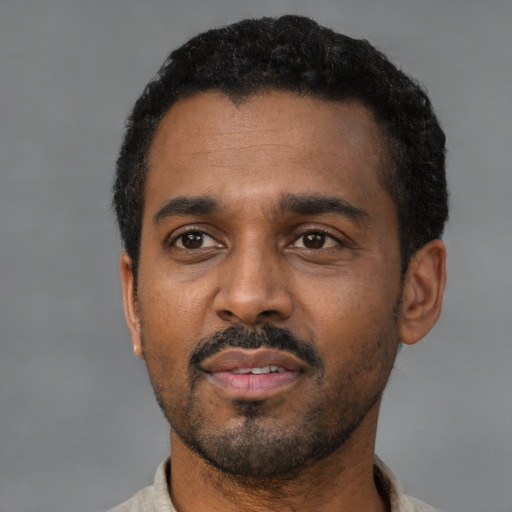 Neutral latino adult male with short  black hair and brown eyes