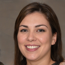 Joyful white young-adult female with medium  brown hair and brown eyes