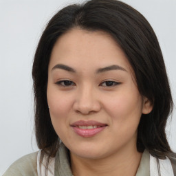 Joyful asian young-adult female with medium  brown hair and brown eyes