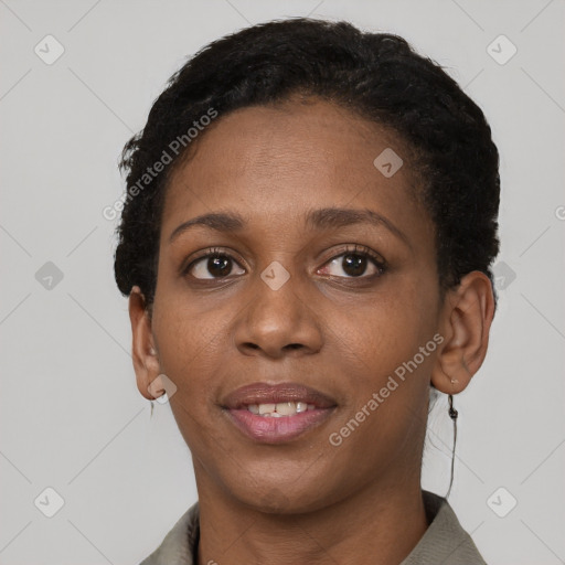 Joyful black adult female with short  brown hair and brown eyes