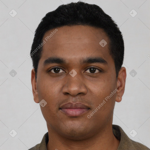 Joyful black young-adult male with short  black hair and brown eyes