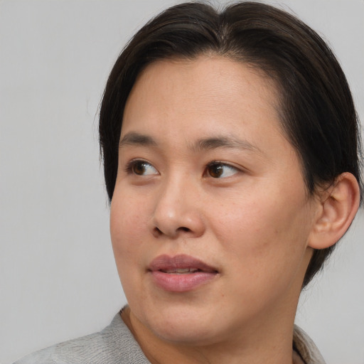 Neutral asian young-adult female with short  brown hair and brown eyes