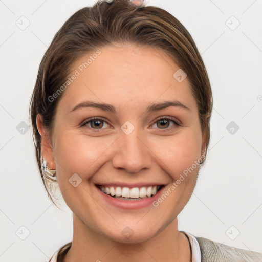 Joyful white young-adult female with medium  brown hair and grey eyes