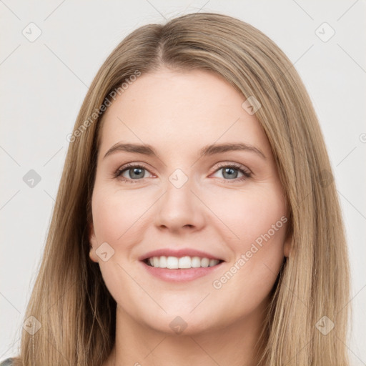 Joyful white young-adult female with long  brown hair and green eyes