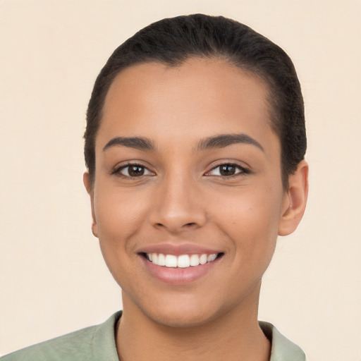 Joyful latino young-adult female with short  black hair and brown eyes