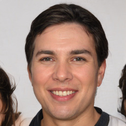 Joyful white young-adult male with medium  brown hair and brown eyes