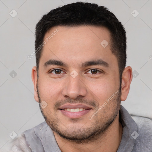 Joyful white young-adult male with short  black hair and brown eyes