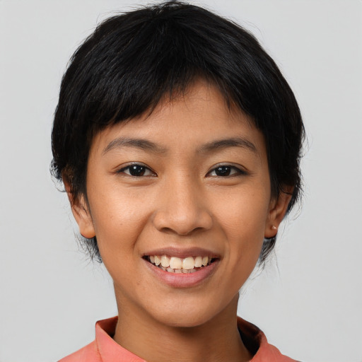 Joyful asian young-adult female with short  black hair and brown eyes