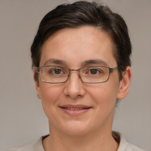 Joyful white adult female with short  brown hair and brown eyes