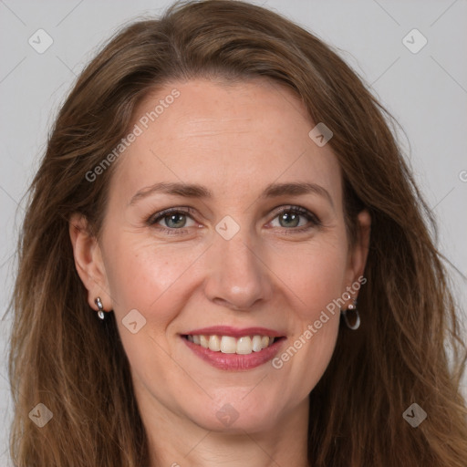 Joyful white adult female with long  brown hair and brown eyes