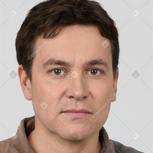 Joyful white adult male with short  brown hair and grey eyes