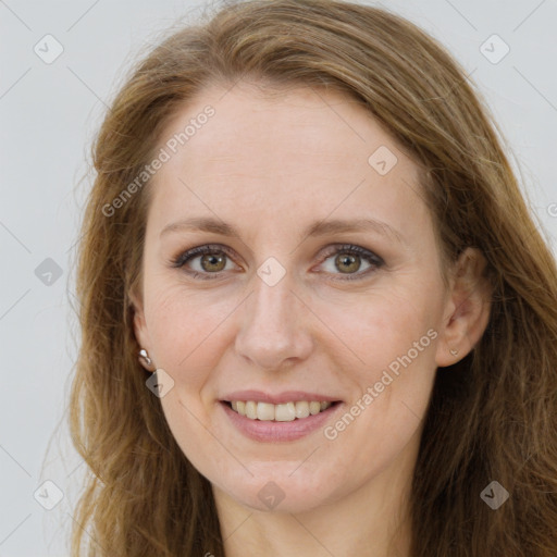 Joyful white young-adult female with long  brown hair and green eyes