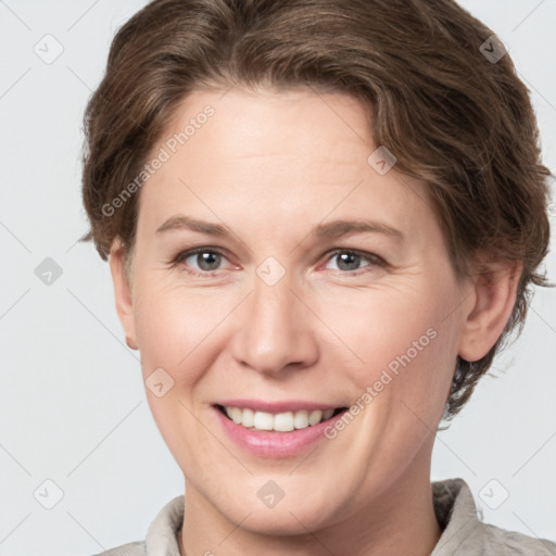 Joyful white adult female with short  brown hair and grey eyes