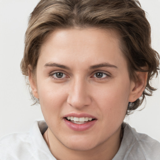 Joyful white young-adult female with short  brown hair and brown eyes