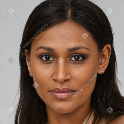 Joyful latino young-adult female with long  brown hair and brown eyes