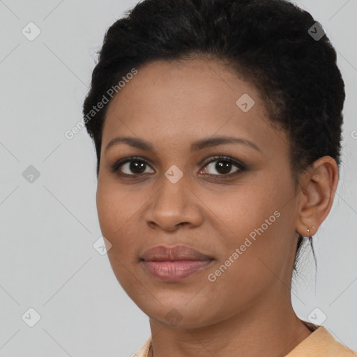 Joyful black young-adult female with short  brown hair and brown eyes