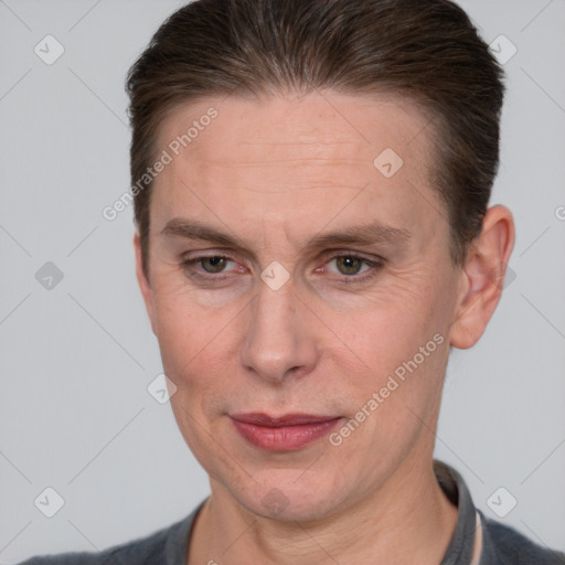 Joyful white adult female with short  brown hair and brown eyes