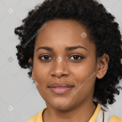 Joyful black young-adult female with long  black hair and brown eyes