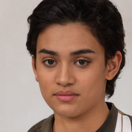 Joyful latino young-adult female with medium  brown hair and brown eyes