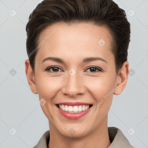 Joyful white young-adult female with short  brown hair and brown eyes