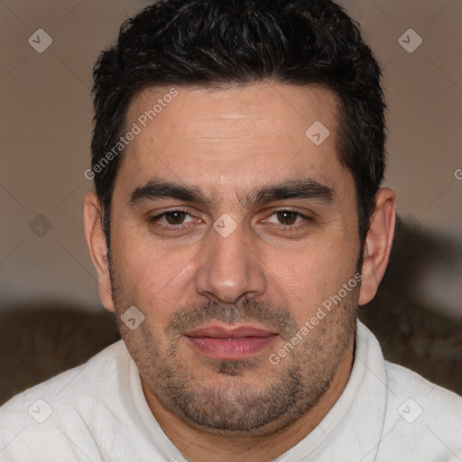 Joyful white adult male with short  brown hair and brown eyes