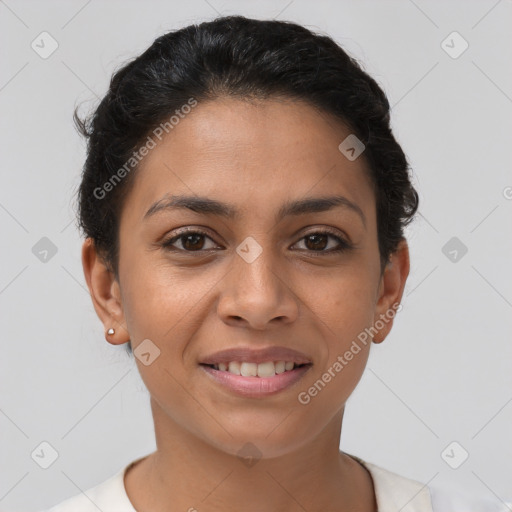 Joyful latino young-adult female with short  brown hair and brown eyes