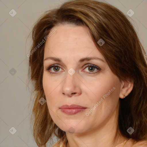 Joyful white adult female with medium  brown hair and brown eyes