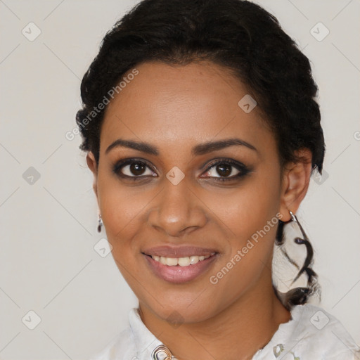 Joyful black young-adult female with medium  black hair and brown eyes