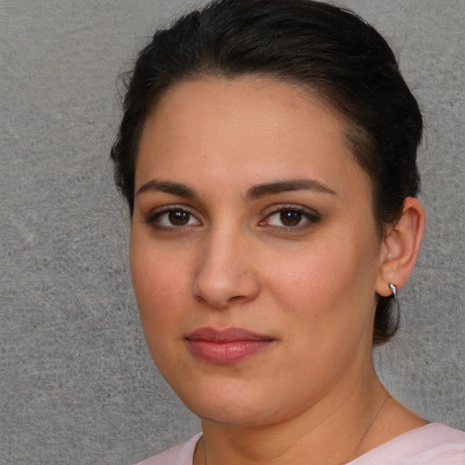 Joyful white young-adult female with short  brown hair and brown eyes