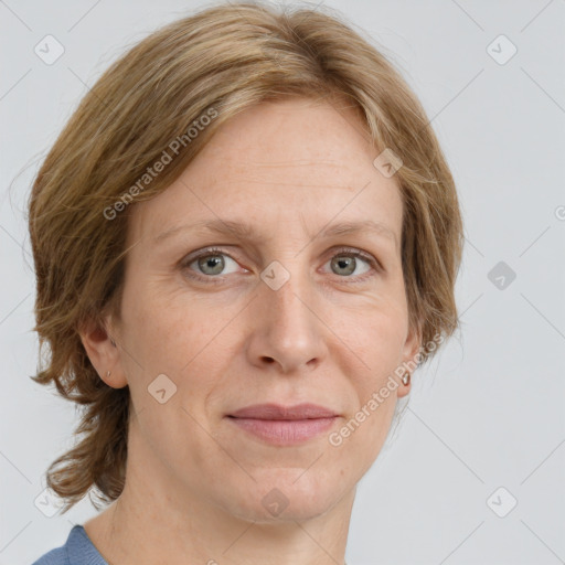 Joyful white adult female with medium  brown hair and blue eyes