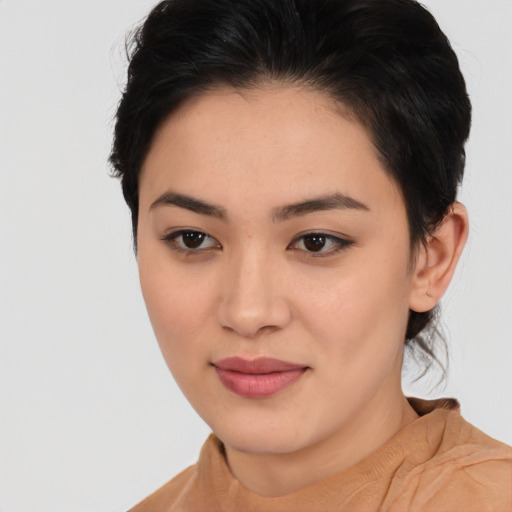 Joyful asian young-adult female with medium  black hair and brown eyes
