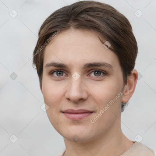 Joyful white young-adult female with short  brown hair and grey eyes