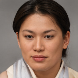 Joyful asian young-adult female with medium  brown hair and brown eyes